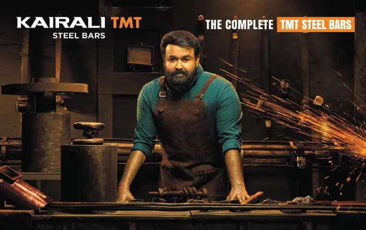 Billboard of Kairali TMT steel bars advertisement in Kochi featuring Malayalam superstar Mohanlal, the complete actor, symbolizing strength and trust in construction. This creative billboard ad reflects expert insights from an SMM and SEO expert in Kochi